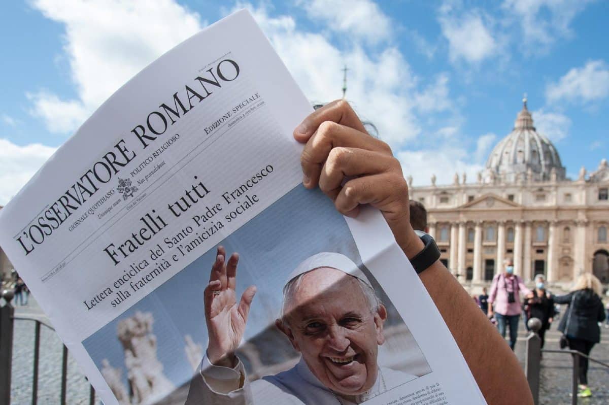Free copies of L'Osservatore Romano, the Vatican newspaper, with the front page about Pope Francis' new encyclical, Fratelli Tutti, on Fraternity and Social Friendship, are distributed by volunteers at the end of the Angelus in St. Peter's Square on October 4. Photo: CNS/ IPA/Sipa USA, Reuters