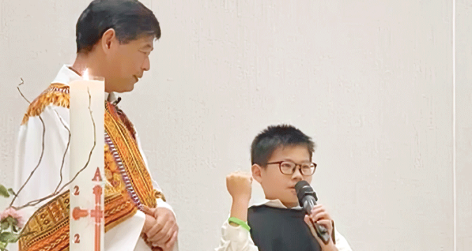 Child delegate spreads his blessings in parish