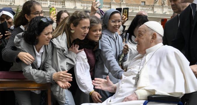 Carry the cross with compassion recovering pope says on Palm Sunday