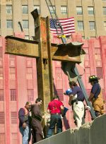 Franciscan Father Brian Jordan, standing with labourers and emergency workers, blesses a 17-foot-tall cross formed by steel beams recovered from the rubble of the World Trade Centre in New York. on 5 October 2001. File photo: CNS/Reuters