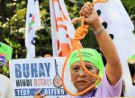 A woman holds up a noose during a protest against plans to reimpose the death penalty in the Philippines. Photo: CNS/Reuters