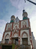 A cross being removed from a bell tower of Yining Catholic Church. Photo: UCAN