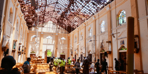 Police examine the devastation after the bombing of St. Sebastian Church in Negombo, Sri Lanka, on April 21. Photo: CNS/Reuters