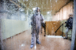 A worker wearing a protective suit in disinfects a bus station in Algiers, Algeria, on March 16. Photo: CNS/Reuters