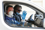 Workers making deliveries for a bank in Rome on March 10. Photo: CNS