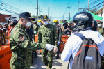 Police officers conduct inspections at the checkpoint near the border of Valenzuela, Bulacan, and Metro Manila, on March 19. Photo: Philippine National Police/ Public Domain