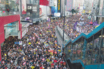 Protestors in black fill all the lanes of Hennessy Road in Causeway Bay, during the massive annual July 1 protest rally in 2019.