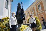 Nurses in protective masks stand in front of a statue of St. John Paul II in Wadowice, Poland, on May 18, during a ceremony to commemorate the 100th anniversary of the late pope's birth. Photo: CNS/Agencja Gazeta via Reuters