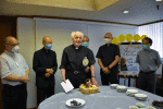 Father Russell with the diocesan curia at his farewell party.