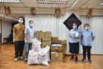Sister Chua receiving donations from Caritas staff on August 10.