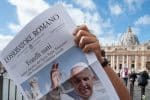 Free copies of L'Osservatore Romano, the Vatican newspaper, with the front page about Pope Francis' new encyclical, Fratelli Tutti, on Fraternity and Social Friendship, are distributed by volunteers at the end of the Angelus in St. Peter's Square on October 4. Photo: CNS/ IPA/Sipa USA, Reuters