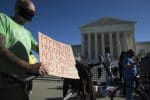 People demonstrate in support of the Affordable Care Act outside the US Supreme Court in Washington DC on November 10. Photo: CNS