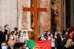 Young people from Portugal with the World Youth Day cross and their country’s national flag following the handover of the cross from their Panamanian peers at the end of Pope Francis’ Mass on the solemnity of Christ the King at St. Peter's Basilica on November 22. Photo: CNS/Reuters pool