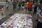 Photographs of victims of enforced disappearances displayed on a sidewalk in Manila. File photo: UCAN/J.L. Burgos