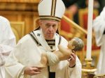Pope Francis carrying a figure of the baby Jesus as he leaves Christmas Mass in St. Peter’s Basilica on 24 December 2019. File photo: CNS