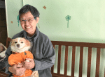 Sister Ho with a pet dog at the shelter.