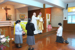 Sister Vivian Bok, right, making her final profession before Bishop Ha.