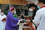 Vitug, right, receives his papal award from Bishop Gaa on December 5. Photo: UCAN/supplied