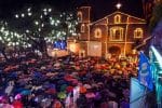 Hundreds of people listen to the celebration of the predawn Mass outside St. Joseph Parish Church in Las Piñas City, Metro Manila, on 16 December 2016. Photo: UCAN/Angie de Silva
