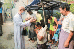 Archbishop Tin, left, imparting blessings on people from St. John's Parish in Mandalay in April 2020. Photo: UCAN/ Social Communication Office Archdiocese of Mandalay