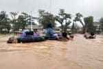 People using inflated inner tubes making their way through the floods that recent struck South Kalimantan. Photo:UCAN/supplied