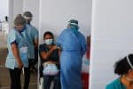 A health care worker receives a dose of Sinopharm's Covid-19 vaccine in Lima, Peru, on February 9. Photo: CNS/Reuters