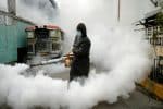 A worker in a hazmat suit disinfects a street in Manila, the Philippines, on March 19. Photo: CNS/Reuters