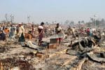 Rohingya refugees sift through the rubble of their destroyed shelters on March 23, after a fire broke out the previous day at a refugee camp in Cox's Bazar, Bangladesh. Photo: CNS/Reuters