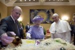Prince Philip offers a gift to Pope Francis during a meeting with Queen Elizabeth II at the Vatican April 3, 2014. Prince Philip's funeral was held April 17 in St. George's Chapel in Windsor Castle. He died April 9 at the age of 99. (CNS photo/Maria Grazia Picciarella, pool)