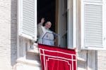 Pope Francis greets the crowd as he leads the Regina Coeli from the window of his studio overlooking St. Peter's Square on May 9. Photo: CNS/Vatican Media