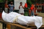 Relatives mourn a man who died of Covid-19 at a crematorium in New Delhi in 2020. Photo: CNS/Adnan Abidi, Reuters