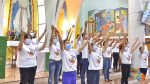Community members performing a dance to the mission song, We give our Yes, to show their determination to serve the Lord.