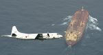A surveillance aircraft flies over an oil tanker in an anti-piracy operation in the Gulf of Aden, off Somalia, in 2015. Photo: CNS /Kyodo