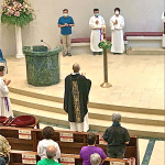 A candle is lit for the dead at St. Benedict Church, Shatin, on June 4.
