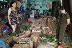 Mary Nguyen Thi Lan, left, selling plums distributed by Father Joseph Nguyen Tien Lien. Photo: UCAN