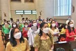 Chinese and Filipino choir members, all in traditional Filipino attire, singing during a Mass marking the 500th anniversary of Christianity in the Philippines in St. Francis’ Church, Ma On Shan, on June 13.