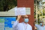 Archbishop Marco Tin Win in front of Sacred Heart Cathedral holding a sign calling for the release of detained leaders on February 8. Photo: UCAN/RVA Myanmar Service