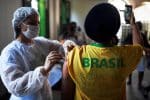A health care worker administers a dose of the Johnson & Johnson Covid-19 vaccine to a resident in Rio de Janeiro on July 10. Photo: CNS/Lucas Landau, Reuters