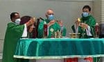 Father Ha celebrating Mass with Father Jyothi, left, and Father Yan, right, at Ma On Shan on July 11.