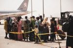 Civilians prepare to board a plane during an evacuation at Hamid Karzai International Airport in Kabul, Afghanistan, on August 18. Photo: CNS photo/Staff Sgt. Victor Mancilla, U.S. Marines handout via Reuters