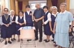 Sister Shum (centre) with Sister Llasos (left), Bishop Ha, along with other Missionary Sisters of Our Lady of Angels after making her perpetual vow.