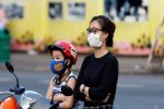 A woman and her child pray outside a church in Ho Chi Minh City. Photo: UCAN/courtesy of tgpsaigon.net