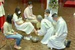 Bishop Chow washes the feet of young people on Holy Thursday