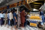 People line up to buy low-priced bun-kabab from a shop in Karachi, Pakistan, on June 10. CNS photo/Akhtar Soomro, Reuters