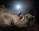 Bright star radiates light over a field of large and small asteroids with dusty clouds surrounding them in space.